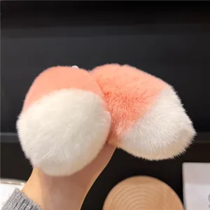 Cute fluffy rabbit fur keychain charm in coral orange and white for bags or keys