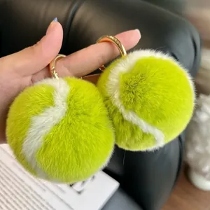 Tennis ball keychain set with fluffy neon green rabbit fur and gold metal ring clips