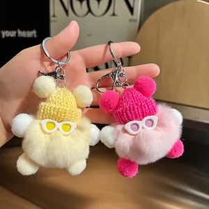 Lot de deux porte-clés monstres en peluche avec mini bonnets tricotés et lunettes