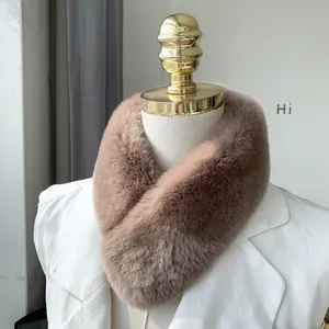 Detailed texture of dusty pink faux rabbit fur neck warmer on a white mannequin