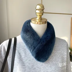 Detail view of navy blue faux fur neck warmer with a soft crossed texture design