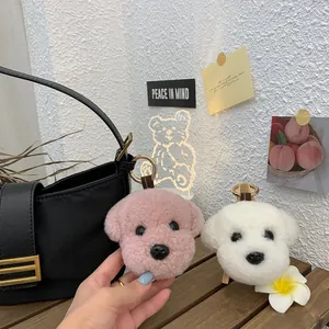Cute teddy and bichon plush bag charms in pink and white wool fabric with gold rings
