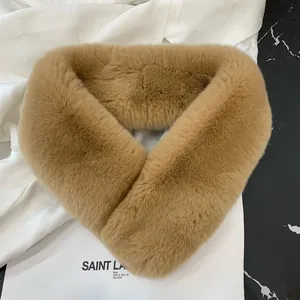 Close-up of soft camel faux fur texture on a thick winter scarf for women