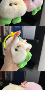 Close-up of plush monster charm with big star eyes and fluffy faux fur texture
