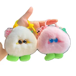 Cute plush peach keychain with big eyes in soft pink and cream colors for bags