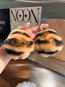 Close-up of tiger stripe faux fur hair clips with luxury golden metal claws