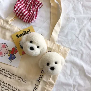Simpatici portachiavi a forma di cagnolino Bichon in peluche bianca su borsa di tela