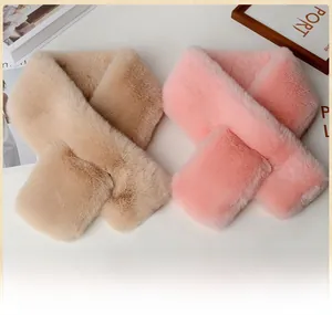 Detailed texture of soft faux rabbit fur scarves in pink and beige crossover design