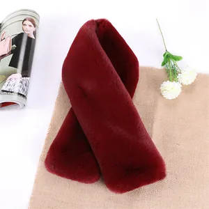 Detailed close-up of thick wine red faux rabbit fur scarf with soft plush texture
