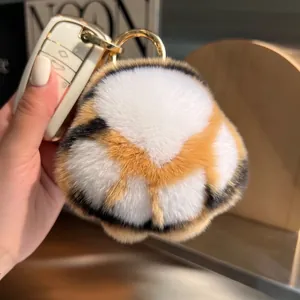Cute faux rabbit fur tiger paw keychain with plush ball pendant on car key sleeve