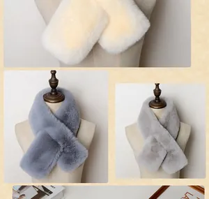 Plush faux rabbit fur scarves in beige and grey colors shown on mannequin busts