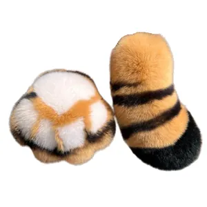 Cute plush tiger tail and paw keychain accessory with fluffy orange and black faux fur