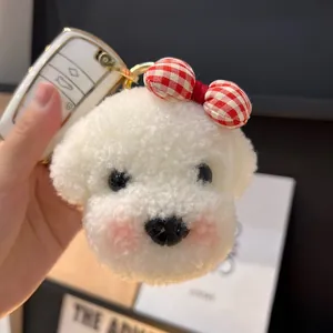 Porte-clés chien en peluche blanche avec nœud à carreaux sur clé de voiture