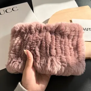 Detail of plush faux rabbit fur infinity scarf in dusty rose with horizontal stripes
