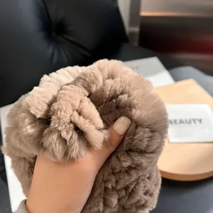 Close-up of thick beige rabbit fur infinity scarf showing soft texture and high density