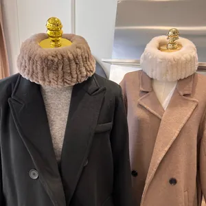 Thick faux fur neck warmer scarves in brown and cream colors with striped texture
