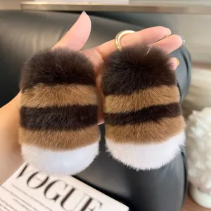 Close-up of fluffy striped rabbit fur keychain with brown and white patterns