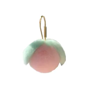 Plüsch-Pfirsich-Schlüsselanhänger in Pink mit grünen Blättern und Goldhaken