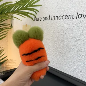 Close-up of cute carrot plush accessory with fluffy orange faux fur and green leaves