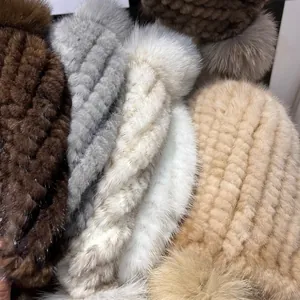 Winter mink fur hats with fox fur pompom in brown, gray, white, and khaki colors