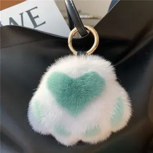 White rabbit fur cat paw keychain with mint green heart and gold metal ring charm