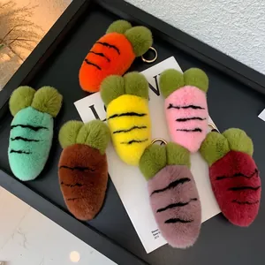 Close-up of colorful plush carrot keychains with fluffy faux fur and golden metal clasps