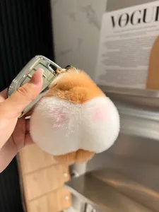 Portachiavi in peluche a forma di sedere di Corgi arancione e bianco su chiave auto
