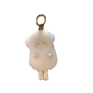 White mink fur sheep plush keychain with golden metal clasp and fluffy lamb design