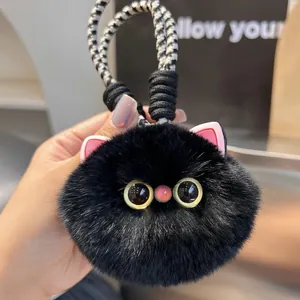 Cute black faux fur cat keychain charm with fluffy texture and woven rope loop