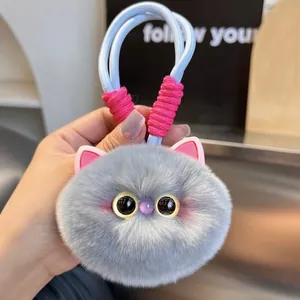Cute gray plush cat keychain accessory with pink ears and soft faux rabbit fur texture