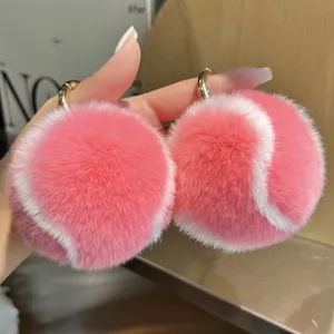 Porte-clés balle de tennis en fourrure de lapin rose et blanc avec anneau doré