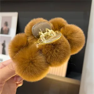 Brown faux rabbit fur plush claw clip hair accessory with a large shark clip design