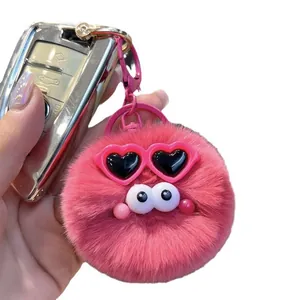 Pink plush bunny fur ball keychain with cute sunglasses and heart frames on car key