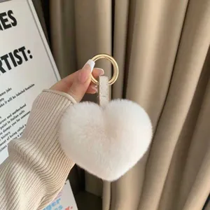Plush heart keychain in cream white with gold metal ring and premium leather strap