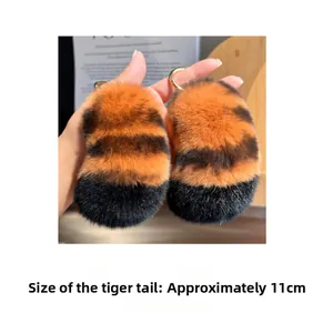 Tiger tail keychain plush pendant with orange and black stripes, 11cm height detail