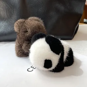 Detail of premium mink fur panda and bear charms showing soft texture and glossy finish