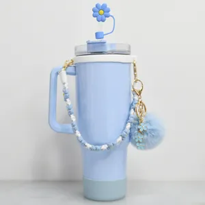 Gobelet isotherme bleu clair 40oz avec couvre-paille fleur et poignée tressée