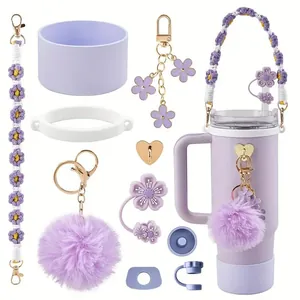 Lavender purple accessory set for tumbler featuring silicone sleeve and flower charm strap