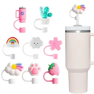 Close-up of 8 cute silicone straw covers featuring cat paw, strawberry and rainbow designs