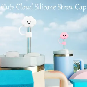 Close-up of pink and white cloud-shaped silicone straw covers with a cute smile design