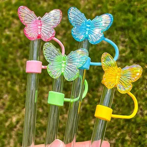 Macro shot of colorful laser butterfly straw covers for Stanley tumblers on glass straws