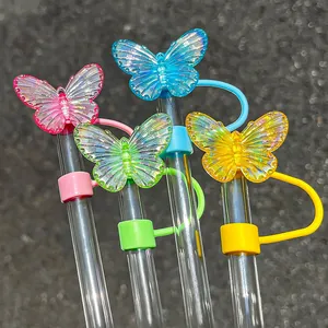 Detail of colorful laser butterfly straw covers in pink blue green and yellow for Stanley cups