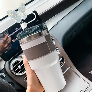 Laser butterfly straw topper on a dual-tone 40oz stainless steel travel tumbler