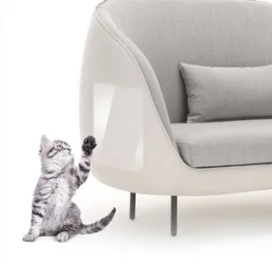 Close-up of clear anti-scratch protector film applied on grey fabric sofa armrest