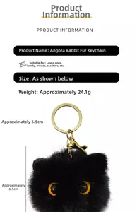 Detail of plush black rex rabbit fur ball keychain with golden lobster clasp and ring