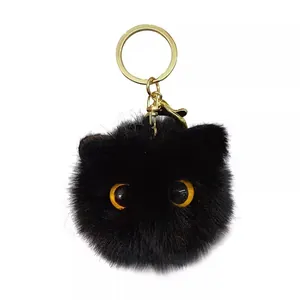 Cute black cat plush keychain with soft long fur and golden metal ring for backpacks