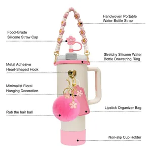 Pink accessories set for Stanley cup including silicone cover, straw cap, and woven handle