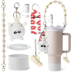 Detail of cute flower charm and woven handle accessory for insulated tumbler cups