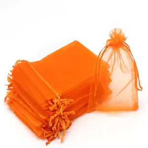 Vibrant orange organza drawstring mesh bags for fruit protection and garden pest control