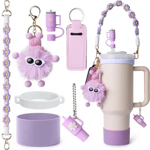 Purple silicone boot and woven flower strap accessories for tumbler on white background